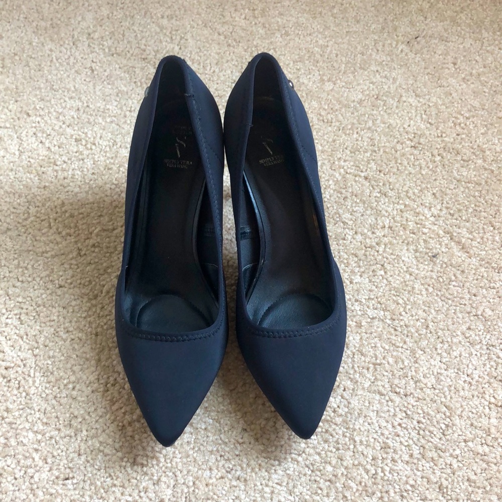 Black pointed toe pumps
